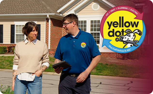 A Yellow Dot technician speaks with a homeowner outside a house. The Yellow Dot logo is displayed on the right side of the image.